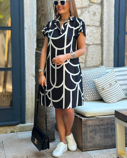 Sybilla – Elegancka sukienka midi z klapami i krótkim rękawem